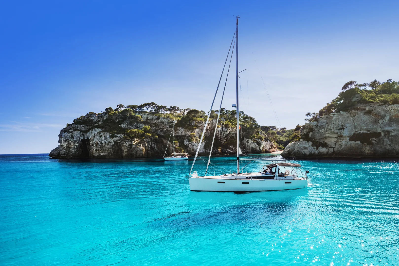 Beautiful beach with sailing boat yacht, Yachting, travel and active lifestyle concept golden yachting.webp