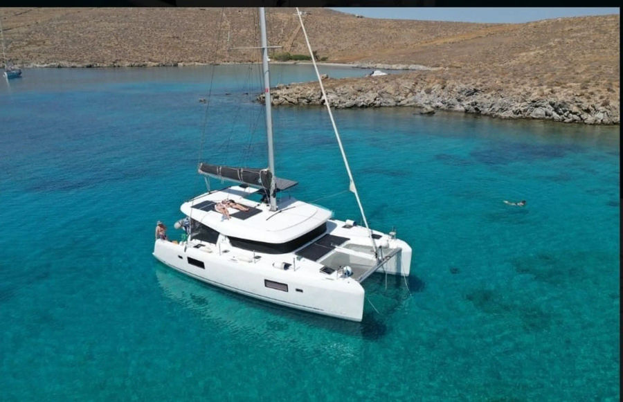 Mykonos Daily Private Catamaran Cruise to either Rhenia/ Delos or Southern beaches Golden Yachting and Sailing