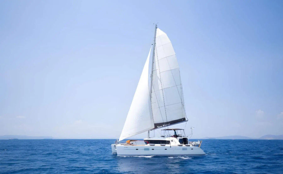 Lagoon 500 shared cruise to southern beaches of Mykonos Golden Yachting and Sailing