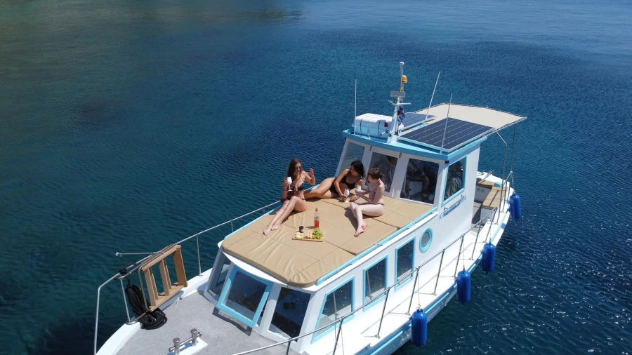Mykonos Half-Day Private Cruise on a Traditional Caique in South Beaches Golden Yachting and Sailing